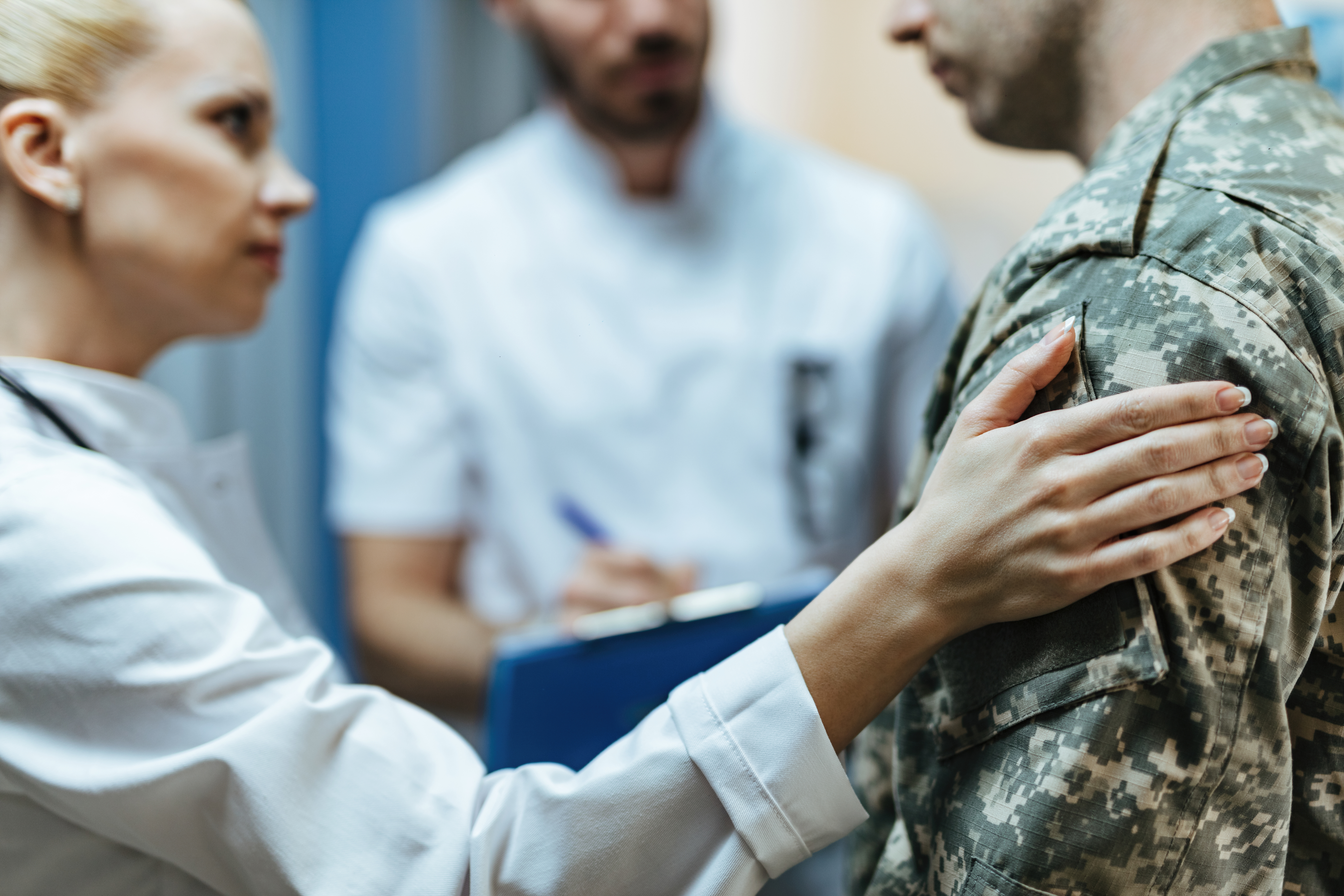 Healthcare workers consoling a patient