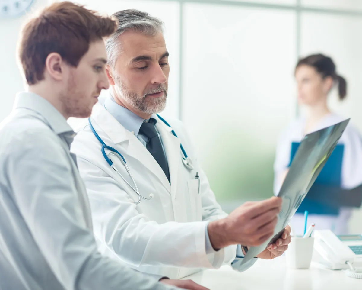 Two physicians reviewing an X-ray together